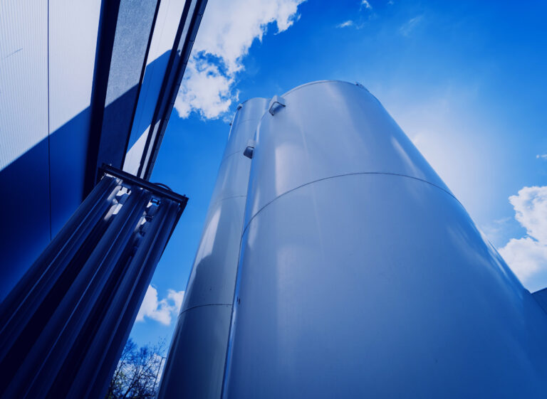 Liquid nitrogen tanks and heat exchanger coils for producing industrial gas